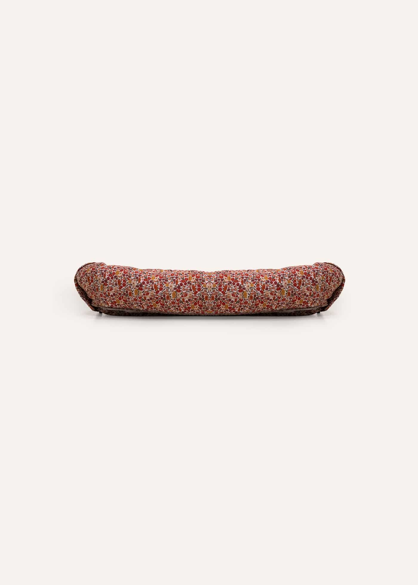 Babynest Claire mit Blumenmuster aus Liberty-Stoff in Rot, Ocker und Beige, seitliche Ansicht
